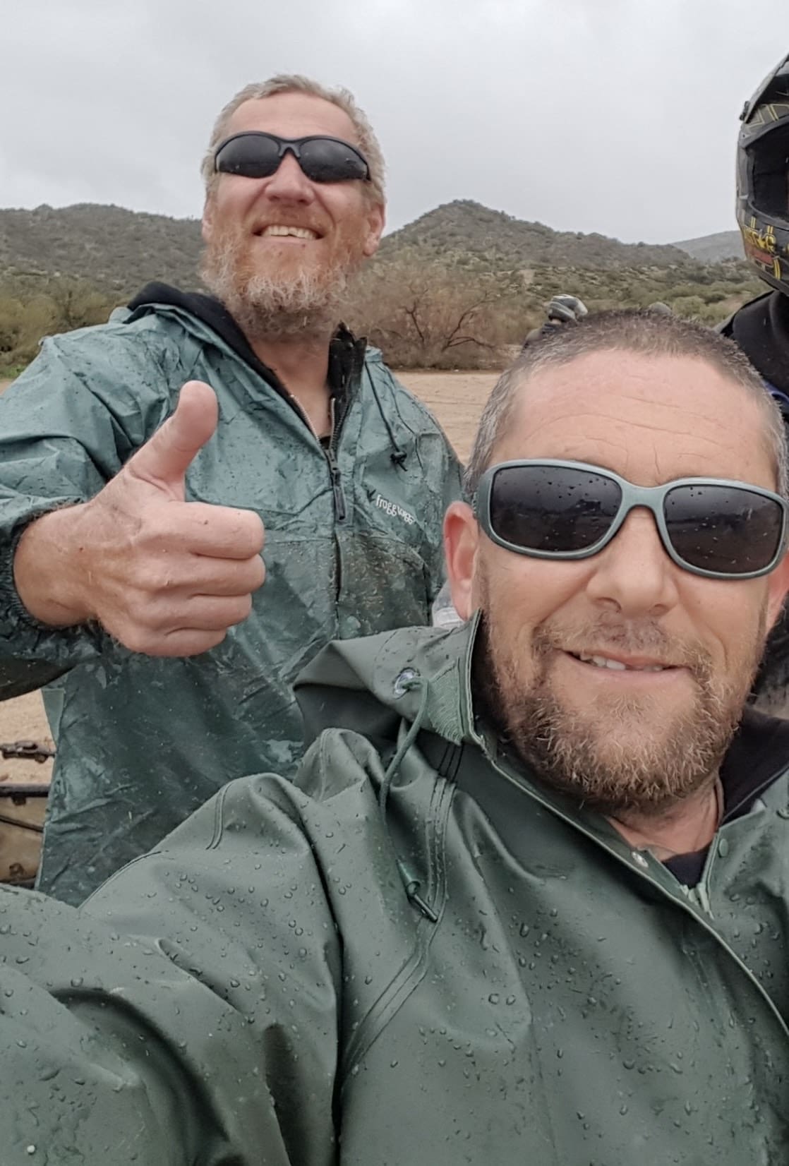 Group of adventurers donning helmets and goggles before a Phoenix ATV tour, emphasizing safety gear essentials.*