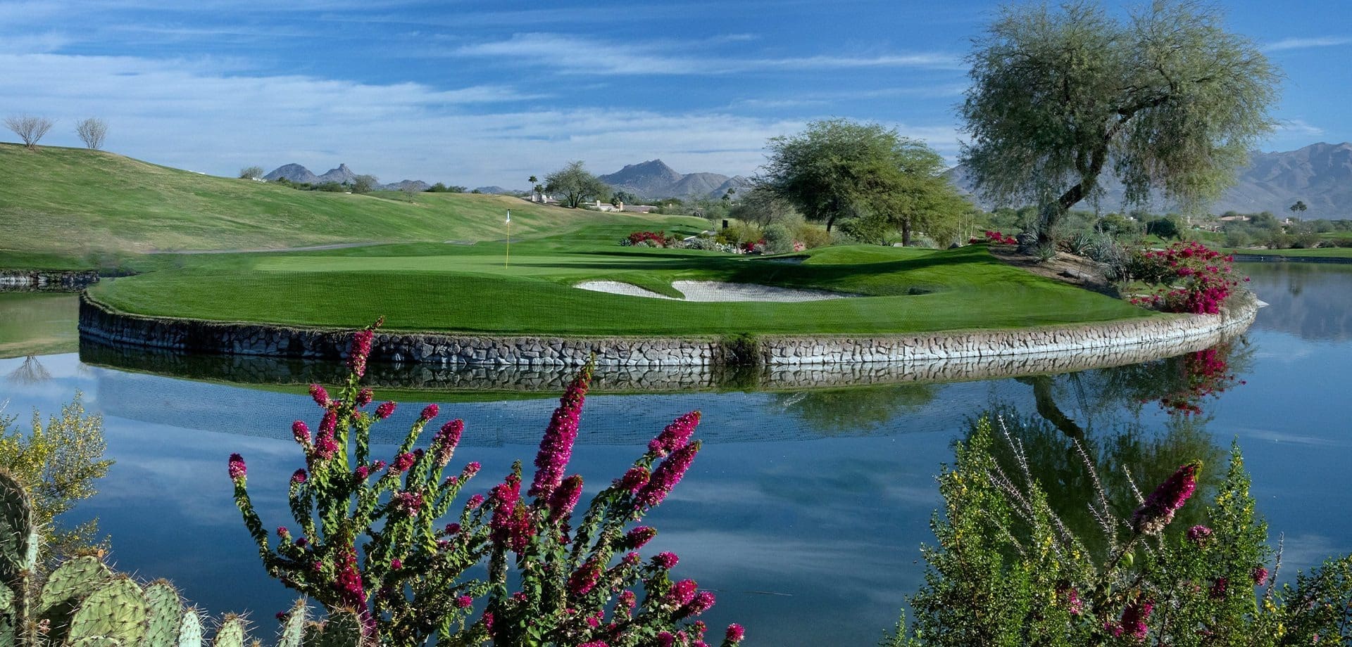 Tee it up on this legendary island green, where the thrill of the carry over water meets the timeless beauty of Scottsdale's championship layouts.4Electric Atmosphere at TPC Scottsdale's Stadium 16th HoleAn exhilarating wide-angle capture of the world-famous 16th hole at TPC Scottsdale during the WM Phoenix Open, with thousands of cheering fans packed into the coliseum-style grandstands surrounding the short par-3 green. Desert bunkers and saguaro cacti frame the action as players navigate the electric energy, underscoring Scottsdale's status as the ultimate golf destination with events that blend sport, spectacle, and community in 2025.Crowded stadium view of TPC Scottsdale's 16th hole during WM Phoenix Open – vibrant crowds and golf action at Arizona's top event.Feel the pulse of golf's "Greatest Show" at TPC Scottsdale's 16th – where roars from 700,000 fans make every shot legendary in Scottsdale's golf paradise.